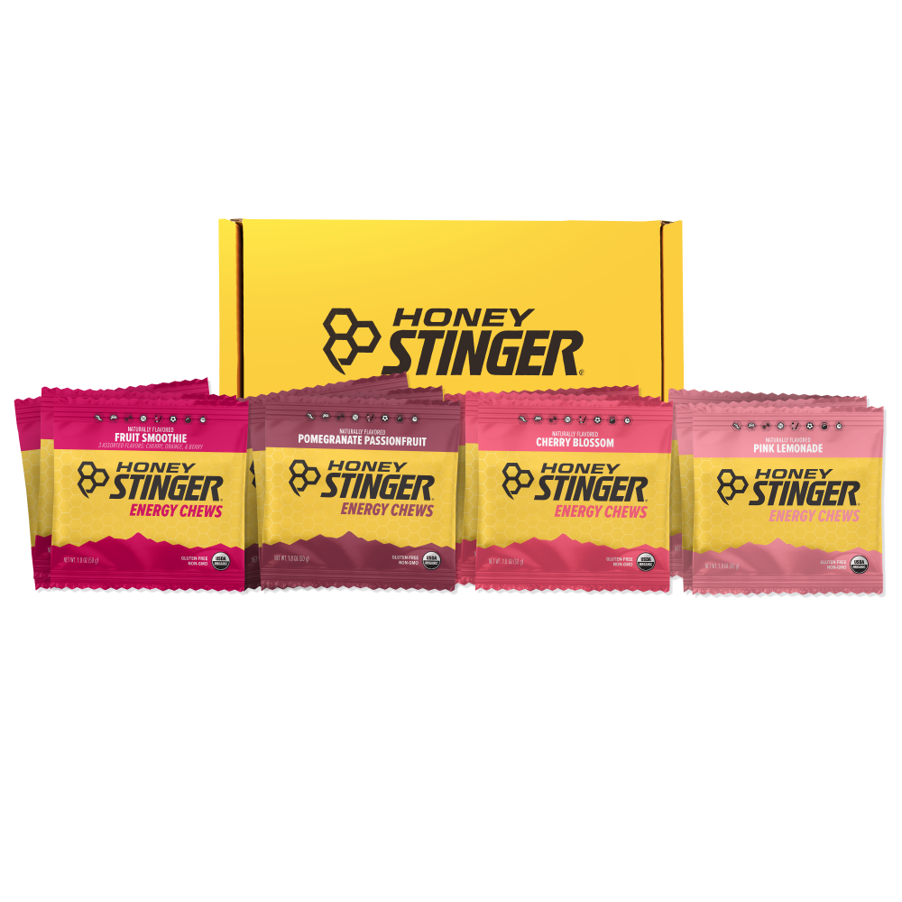 Honey Stinger Organic Energy Chews variety pack featuring fruit smoothie, pomegranate passionfruit, pink lemonade, and cherry blossom flavors.