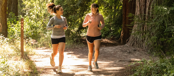GU Energy Pom Pom Beanie in vibrant colors, featuring a fluffy pom pom on top, perfect for winter accessories.