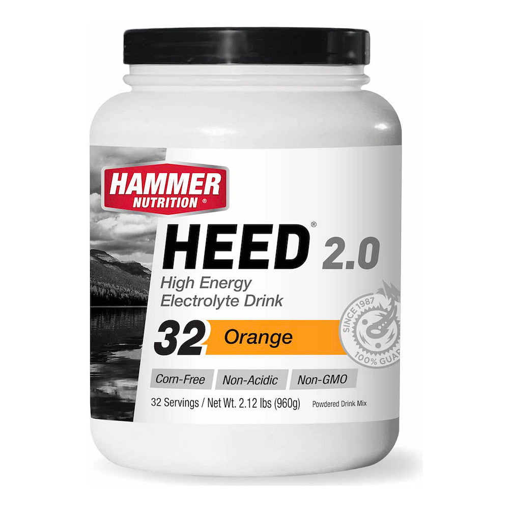 Hammer Nutrition Heed energy drink in Mandarin-Orange flavor, 32 servings, featuring a vibrant orange powder in a scoop.