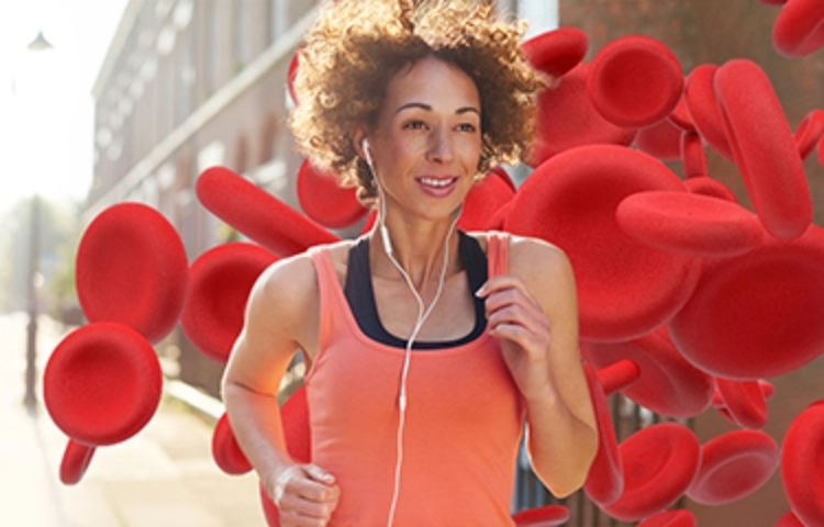 Female jogger using EPO-BOOST natural blood builder & EPO stimulator from BRL Sports during outdoor exercise.