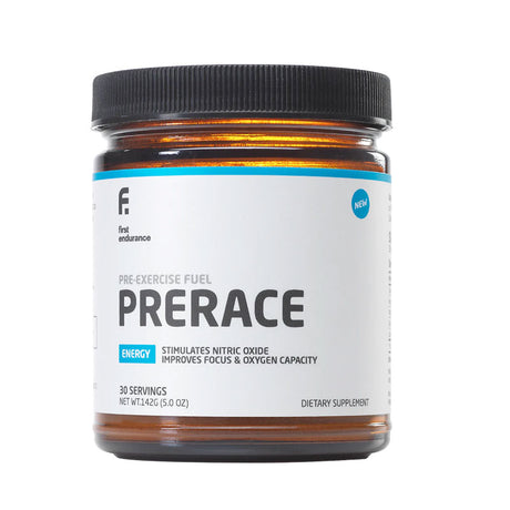 First Endurance Pre Race 2.0 powder container with scoop, showing the label and product packaging for athletic pre-race nutrition.