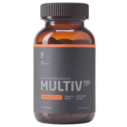 First Endurance MULTIV-PRO premium multivitamin capsules in a bottle, designed for endurance athletes.
