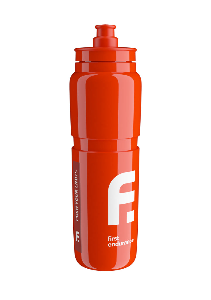 First Endurance Elite FLY water bottle with a sleek design, featuring a clear body and a black cap for easy hydration on the go.