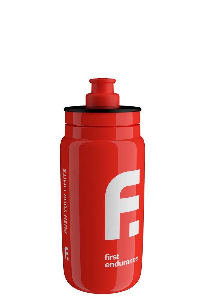 First Endurance Elite FLY water bottle with a sleek design, clear bottle body, and blue lid for hydration during sports.