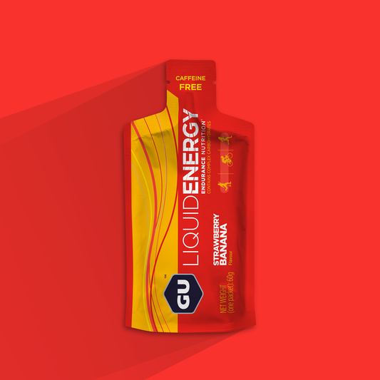 GU Energy Labs Liquid Energy Gel in Strawberry Banana flavor, 60g single serve pack, displayed on a white background.