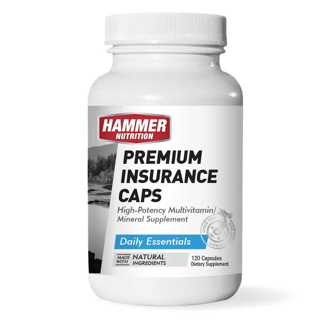 Hammer Nutrition Premium Insurance Caps multivitamin supplement bottle with capsules on a white background.