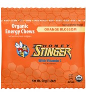 Box of Honey Stinger Organic Energy Chews 12-pack with colorful packaging and honey-themed branding.