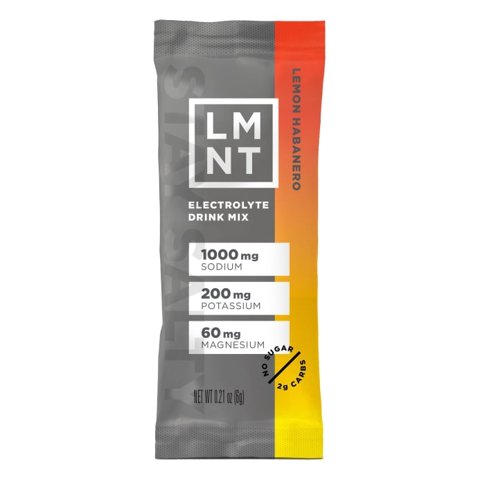 LMNT Electrolyte Drink Mix packets in assorted flavors, ideal for paleo-keto hydration without sugar.