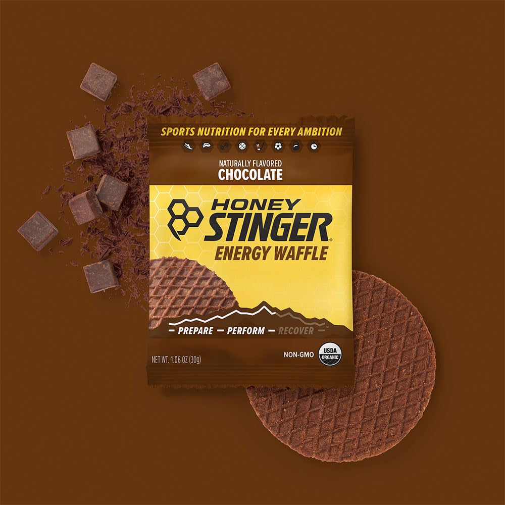 Organic Waffles Variety Pack by PROLINE SPORTS NUTRITION, 12-count with honey, vanilla, and chocolate flavors, plus a sticker.