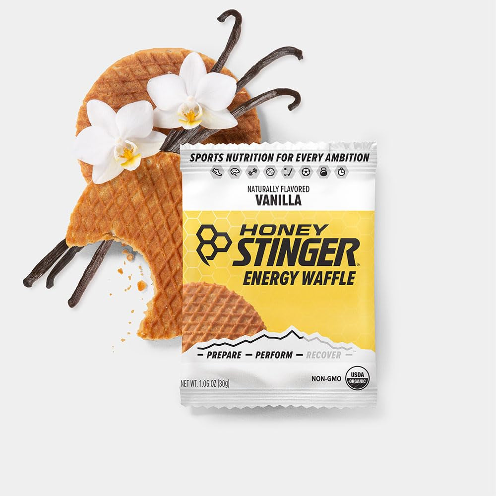 Organic Waffles variety pack by PROLINE SPORTS NUTRITION, 12 gluten-free waffles with honey, vanilla, and chocolate flavors, includes sticker.