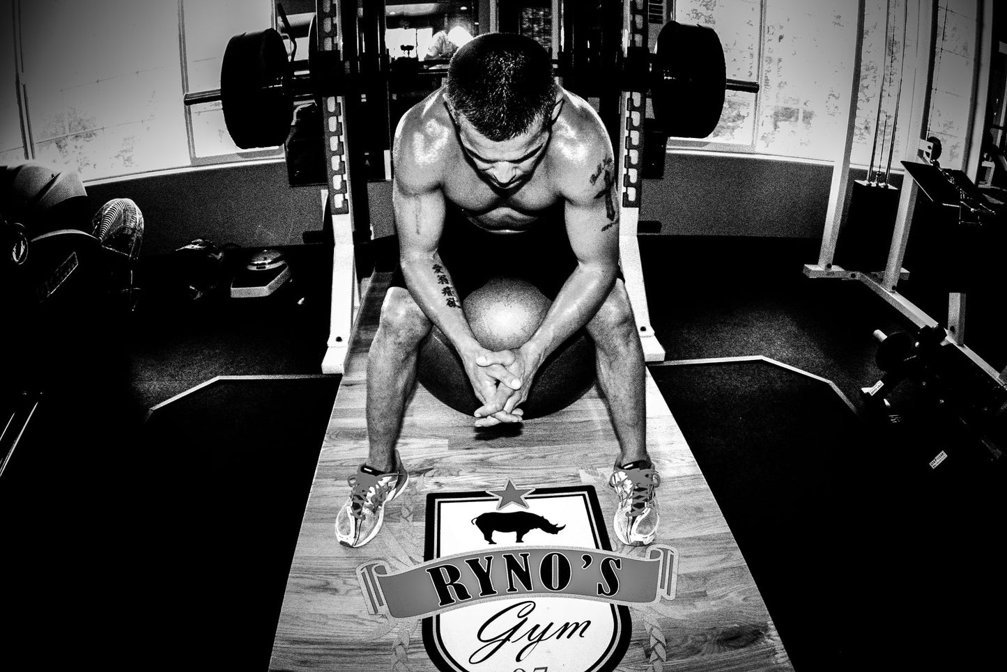 Ryno Power Gladiator Pre-Workout Drink Mix in a container with scoop for athletic energy and performance enhancement.