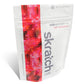 Skratch Labs Everyday Hydration Mix 1 lb container with orange flavor, showing the product label and scoop for hydration.
